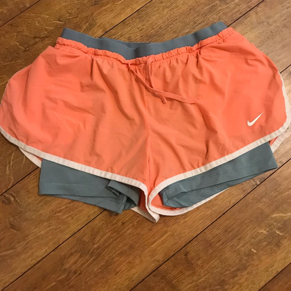 Peach Nike running shorts